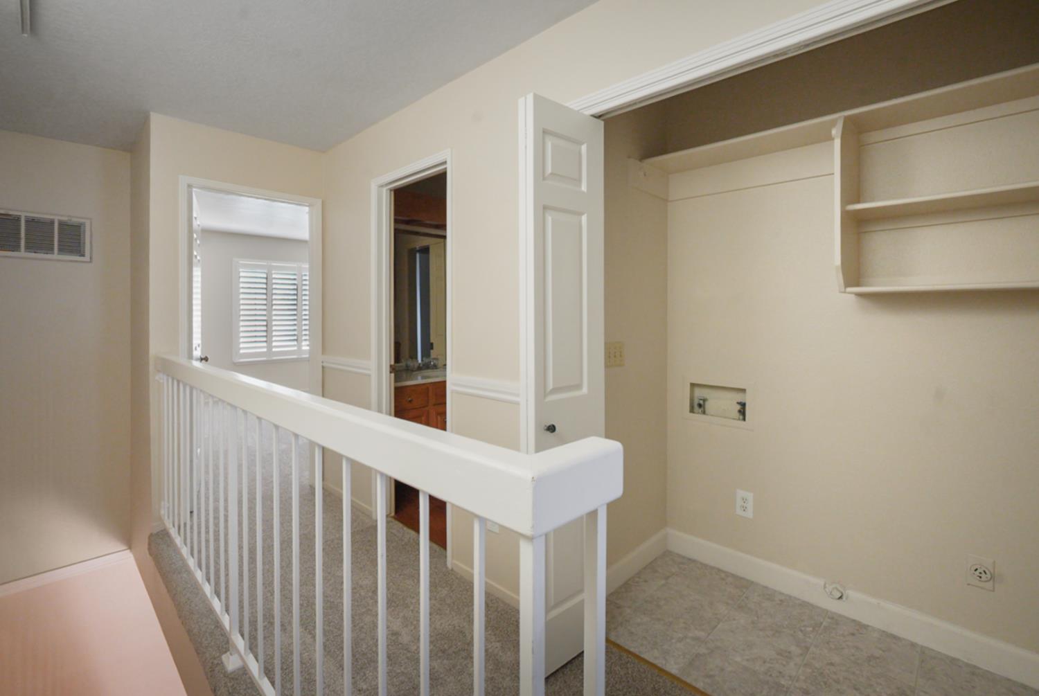 230 West Rumble Road, Unit B Modesto, CA 95350 - Photo 12 of 24 a view of a hallway with windows