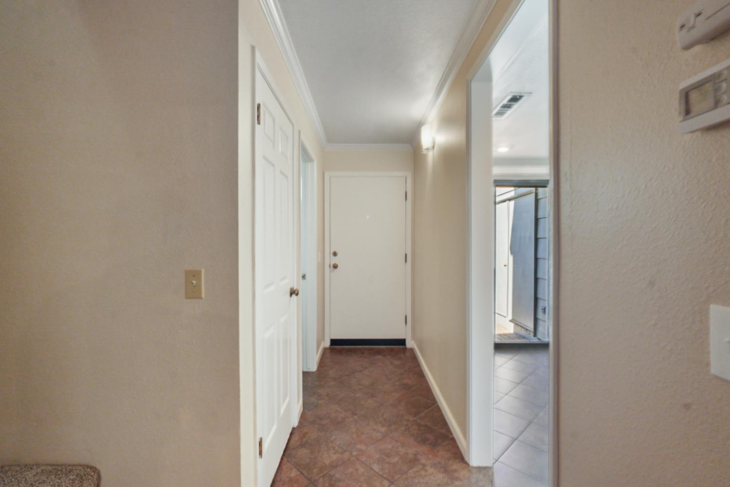 230 West Rumble Road, Unit B Modesto, CA 95350 - Photo 3 of 24 a view of a hallway with wooden floor
