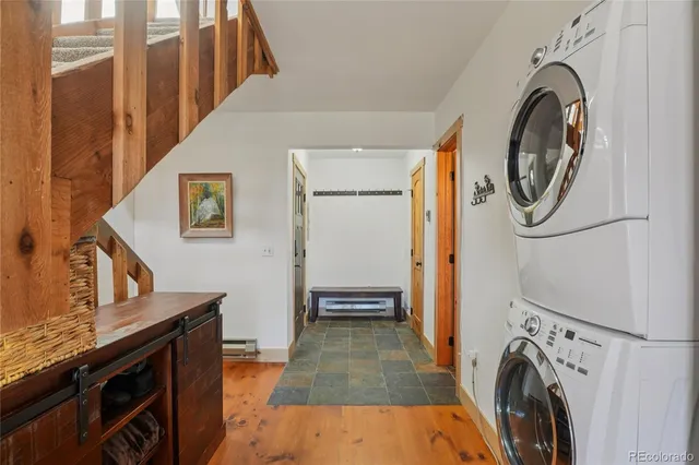 a view of a hallway with washer and dryer
