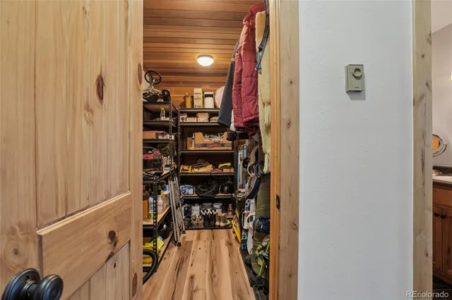 a view of a gallery with wooden floor