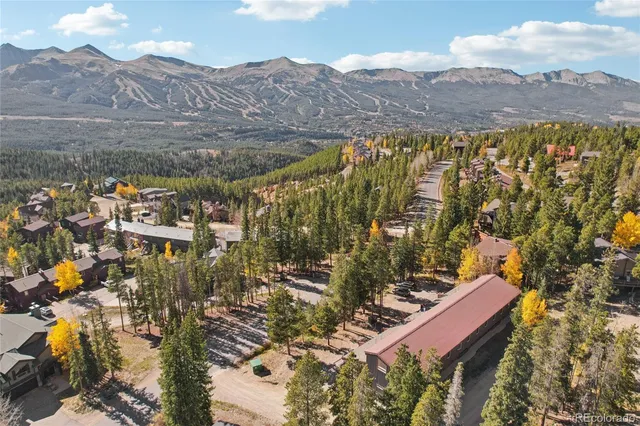 a view of a city with mountains in the background