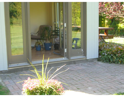 18 Stinson Road Andover, MA 01810 - Photo 15 of 15 a room with a glass door and mountain view