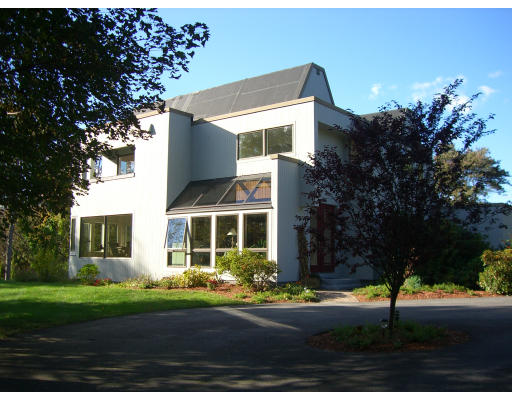 18 Stinson Road Andover, MA 01810 - Photo 4 of 15 a front view of a house with a garden