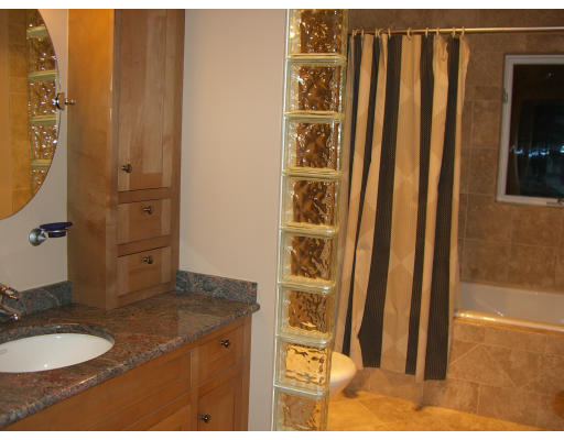 18 Stinson Road Andover, MA 01810 - Photo 9 of 15 a bathroom with sink a mirror and shower
