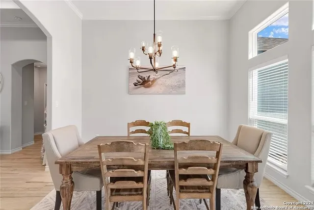 a view of a dining room with furniture and wooden floor