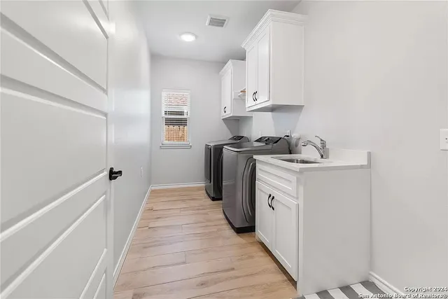 a view of a kitchen with electric appliances
