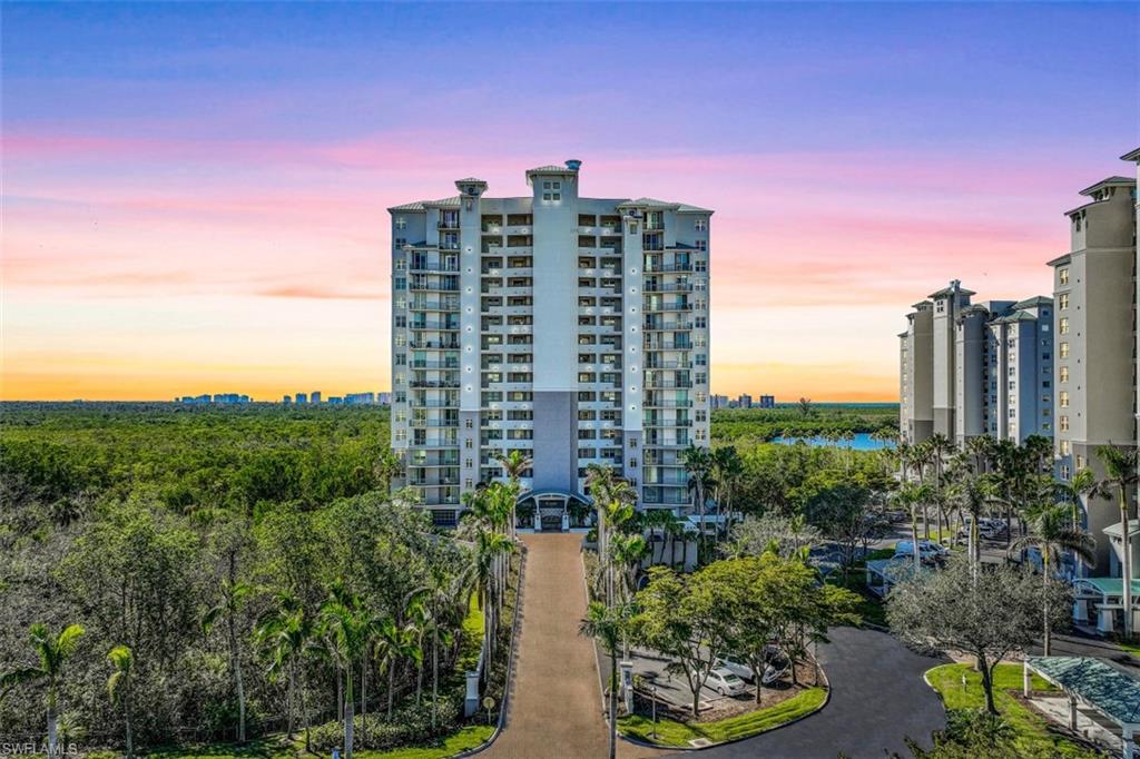 425 Cove Tower Drive, Unit 301 Naples, FL 34110 - Photo 1 of 43 a view of a city with tall buildings
