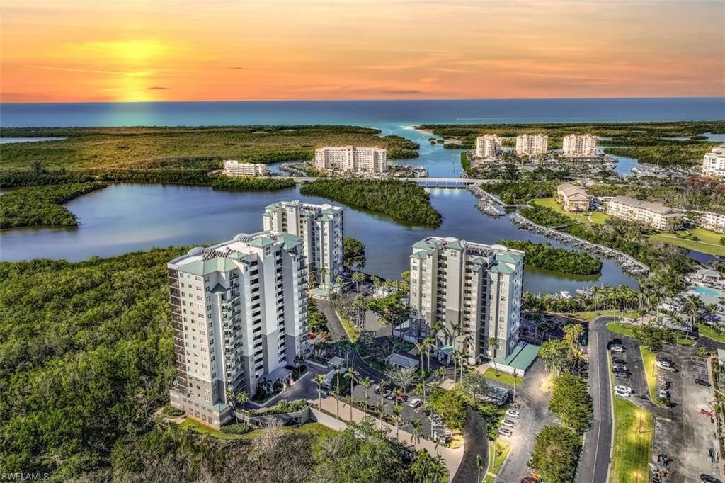 425 Cove Tower Drive, Unit 301 Naples, FL 34110 - Photo 2 of 43 a view of a city with tall buildings