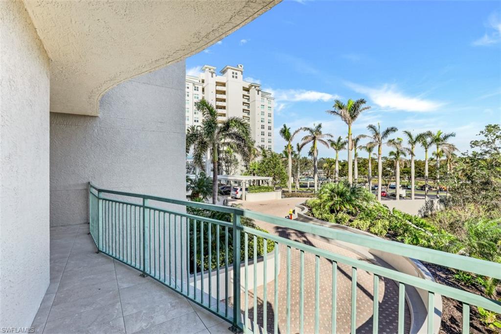 425 Cove Tower Drive, Unit 301 Naples, FL 34110 - Photo 32 of 43 a view of a balcony with an outdoor space