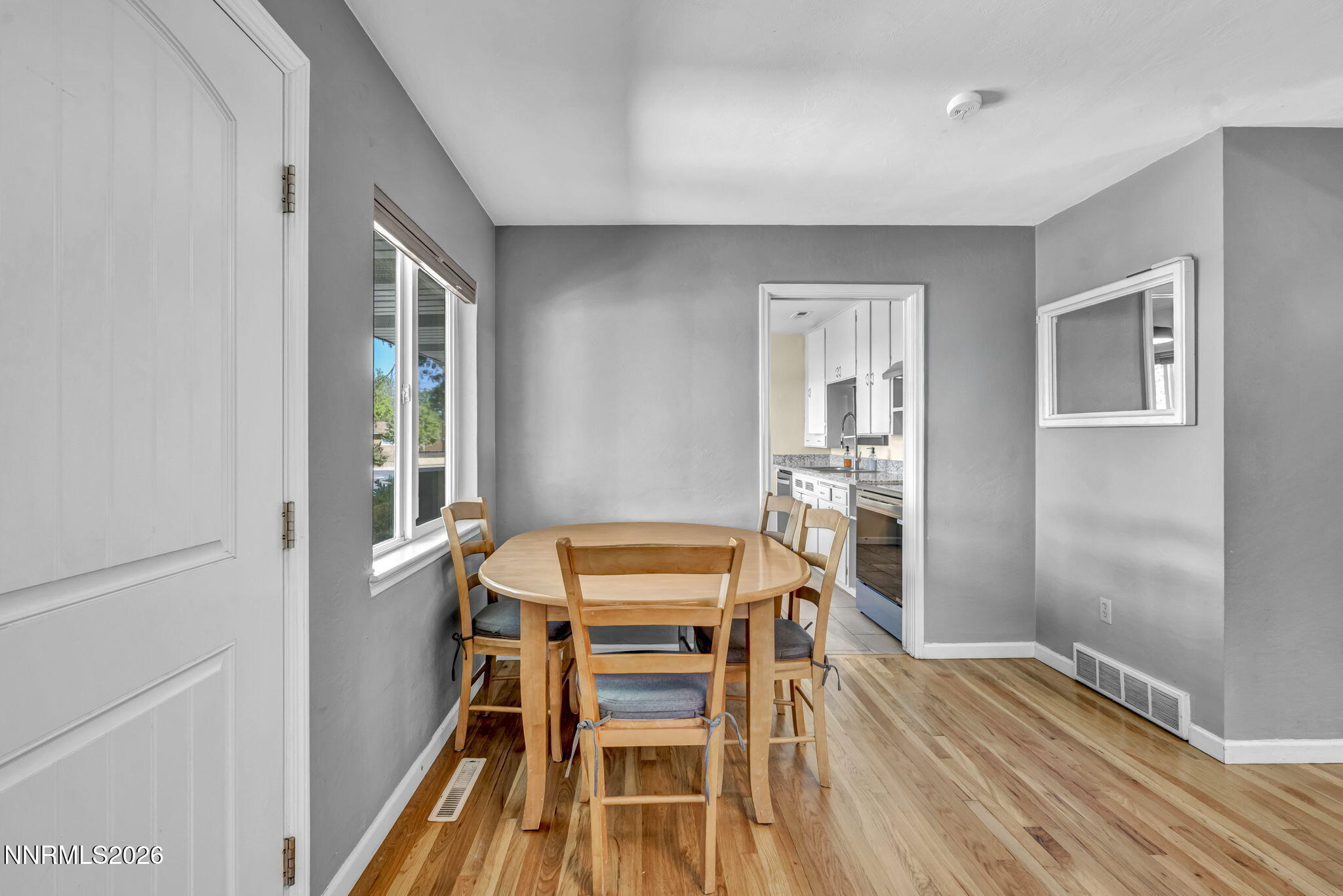 620 Belgrave Avenue Reno, NV 89502 - Photo 12 of 57 a view of a dining room with furniture and wooden floor