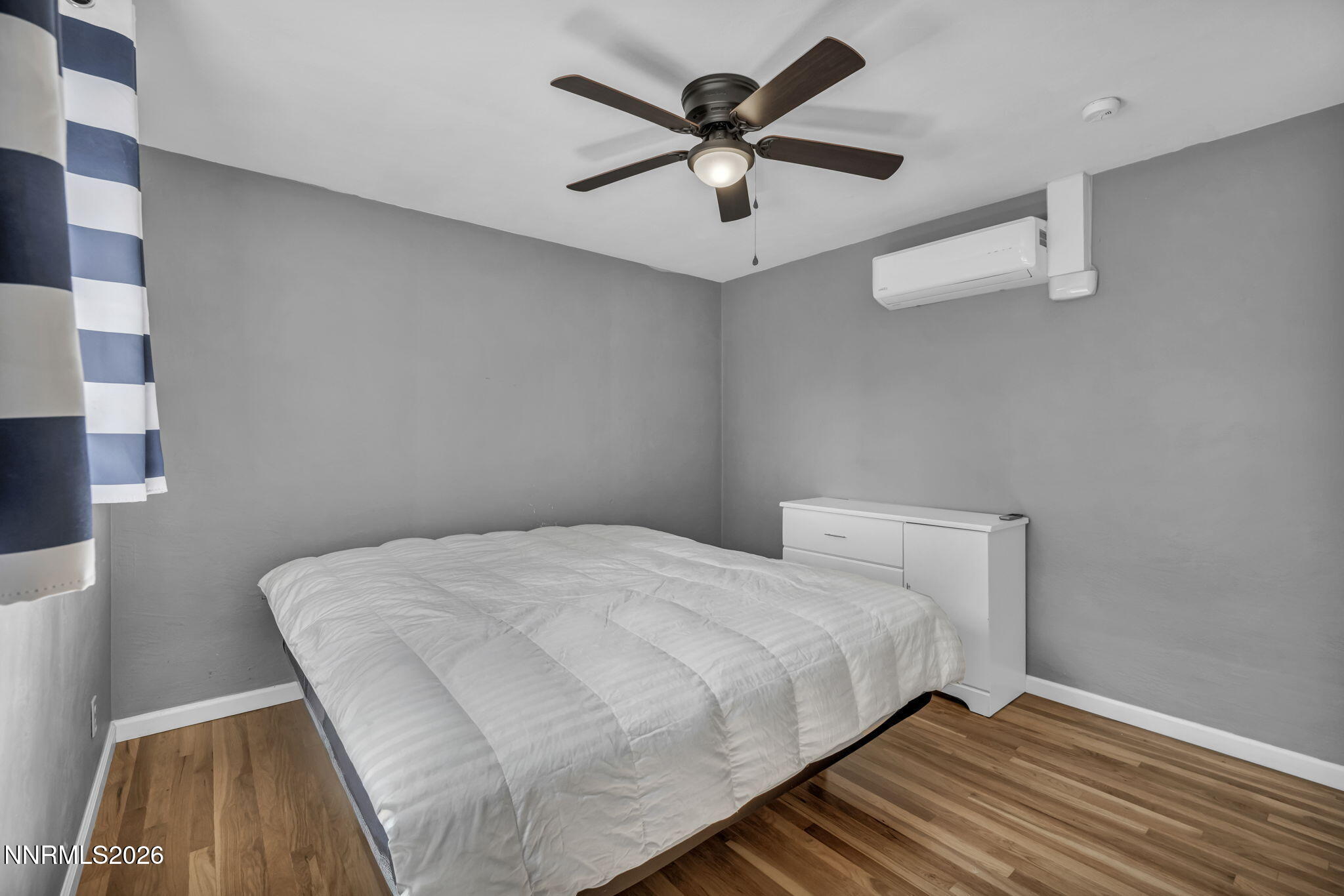 620 Belgrave Avenue Reno, NV 89502 - Photo 23 of 57 a bedroom with a bed and a ceiling fan