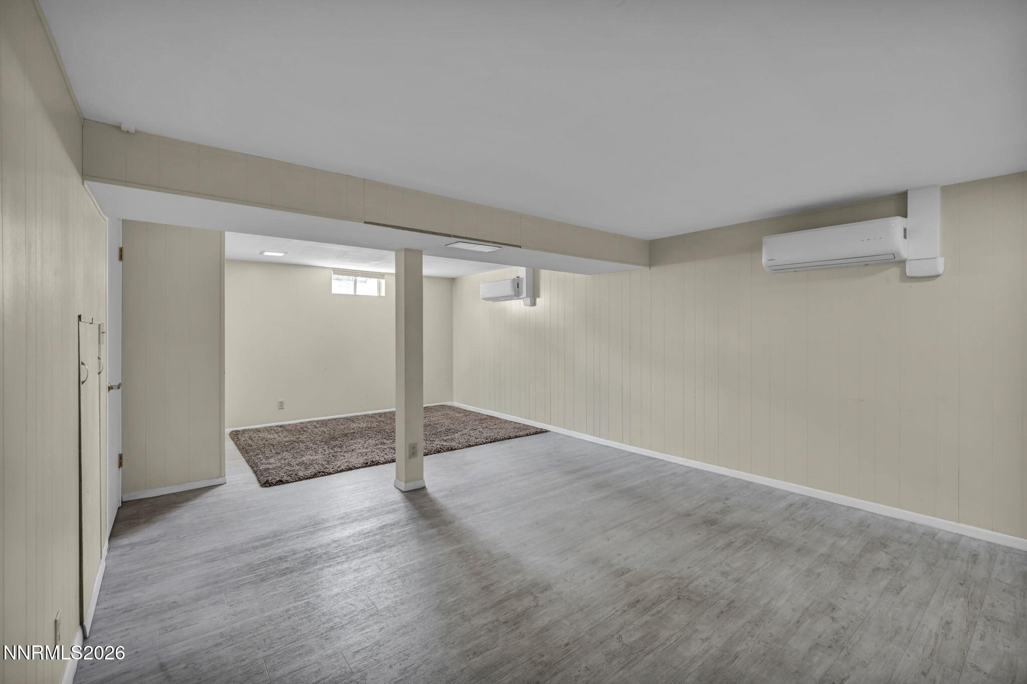 620 Belgrave Avenue Reno, NV 89502 - Photo 29 of 57 an empty room with wooden floor and windows