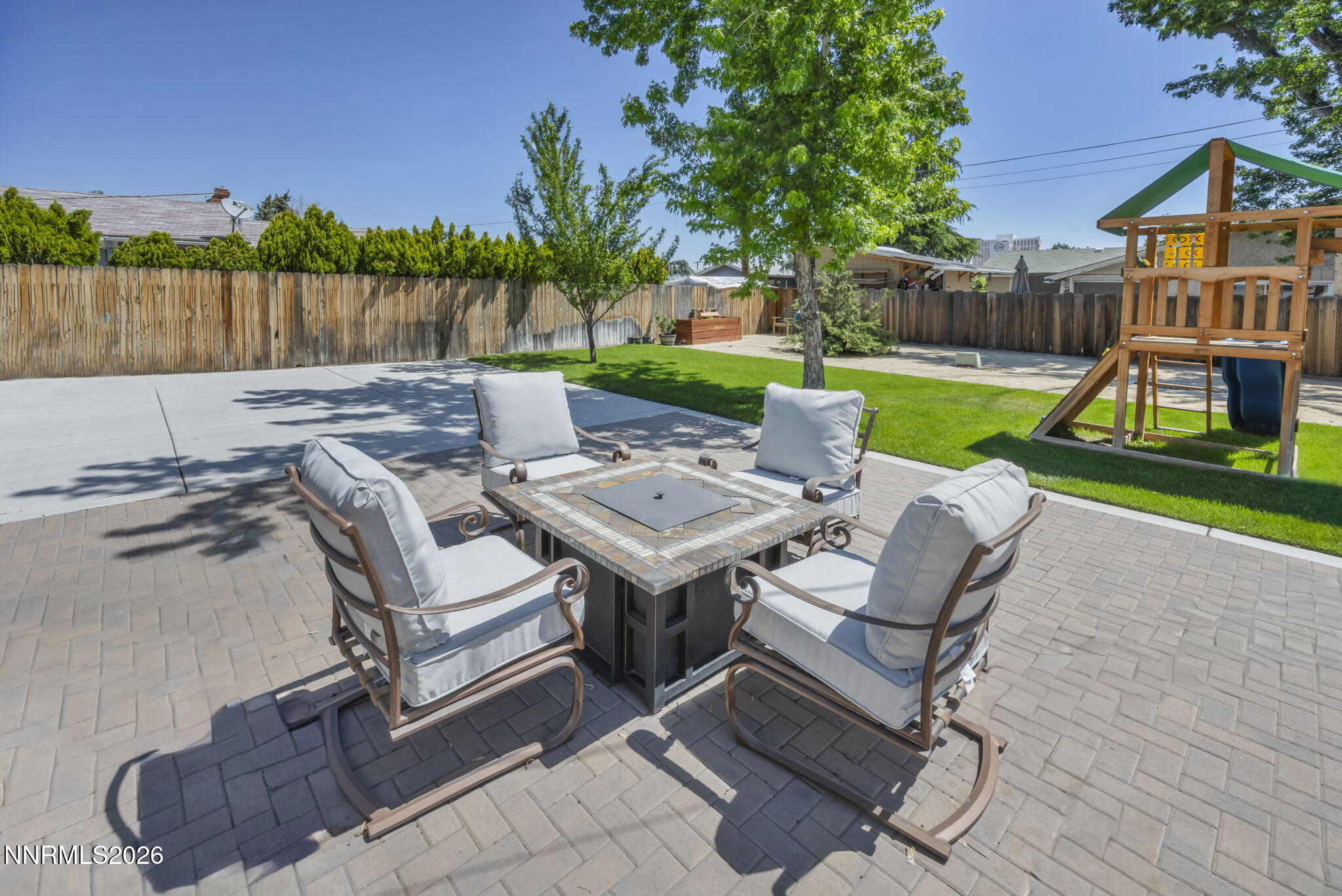 620 Belgrave Avenue Reno, NV 89502 - Photo 42 of 57 a view of yard with seating area and trees in the background