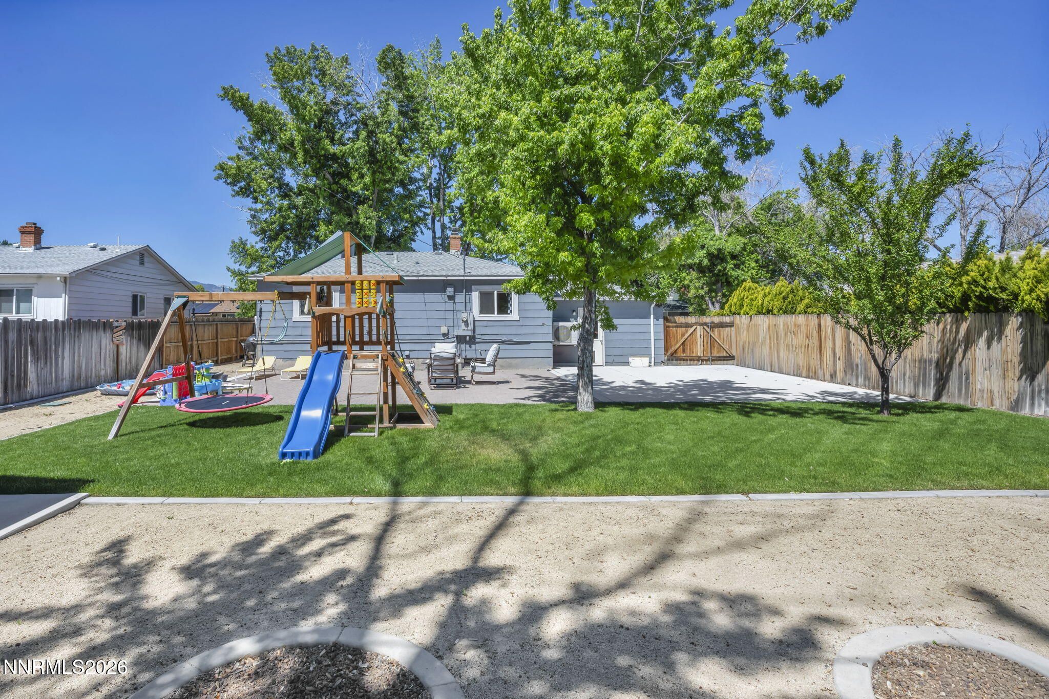620 Belgrave Avenue Reno, NV 89502 - Photo 47 of 57 a front view of a house with a yard and a bike