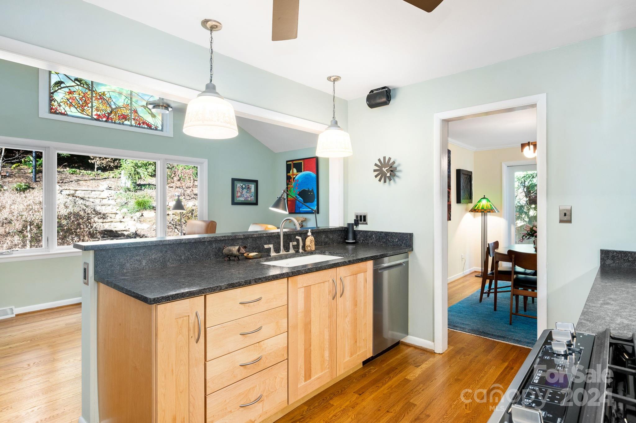 24 Maplewood Road Asheville, NC 28804 - Photo 11 of 38 a kitchen with granite countertop lots of counter top space