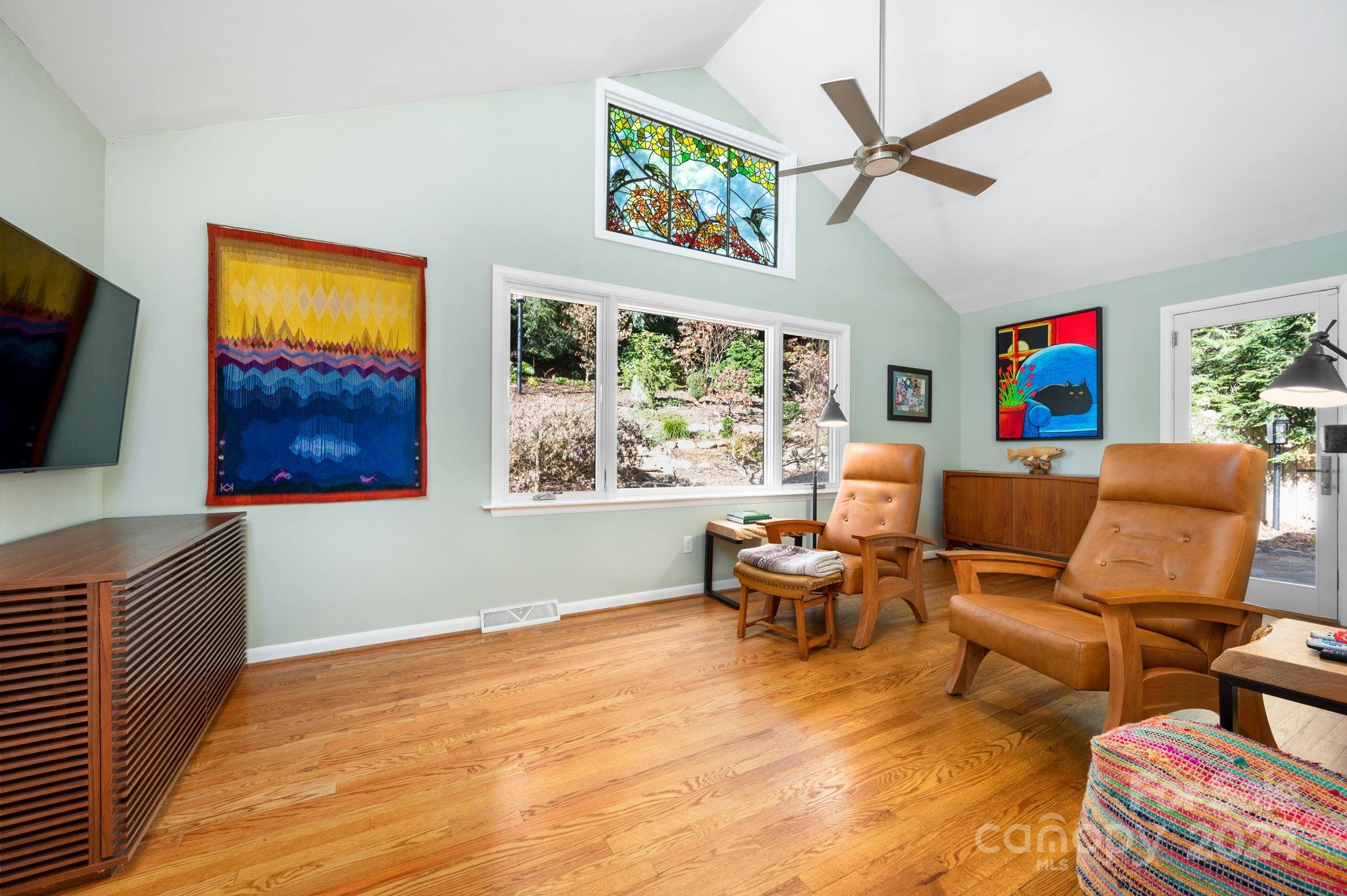 24 Maplewood Road Asheville, NC 28804 - Photo 13 of 38 a living room with furniture a flat screen tv and a window