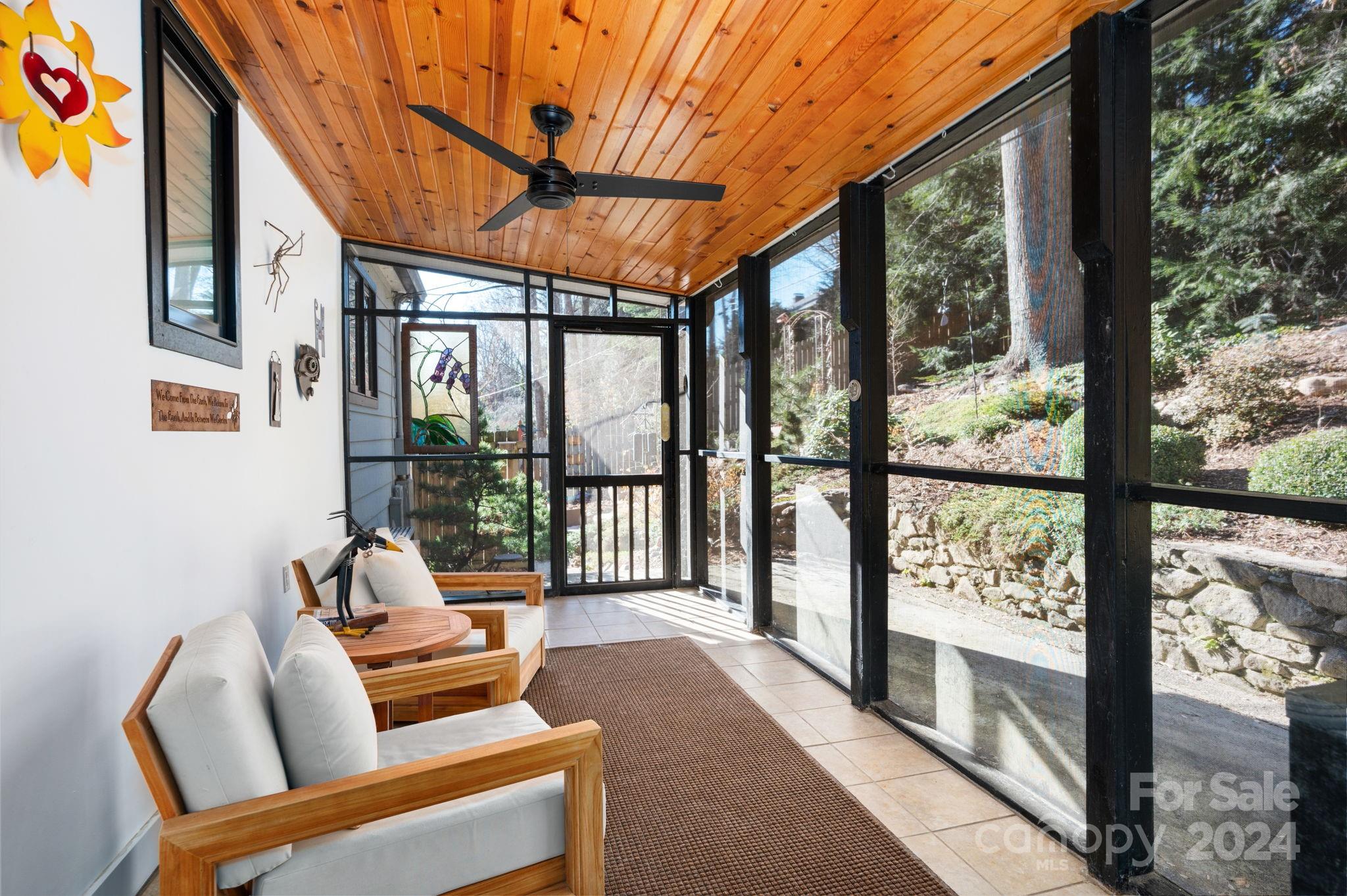 24 Maplewood Road Asheville, NC 28804 - Photo 21 of 38 a balcony with furniture and a road