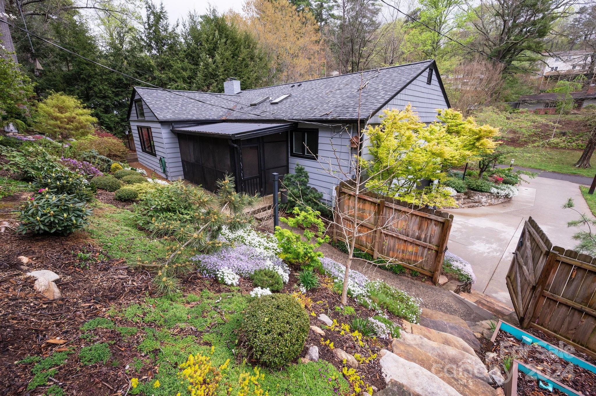 24 Maplewood Road Asheville, NC 28804 - Photo 22 of 38 a view of a house with wooden fence and garden