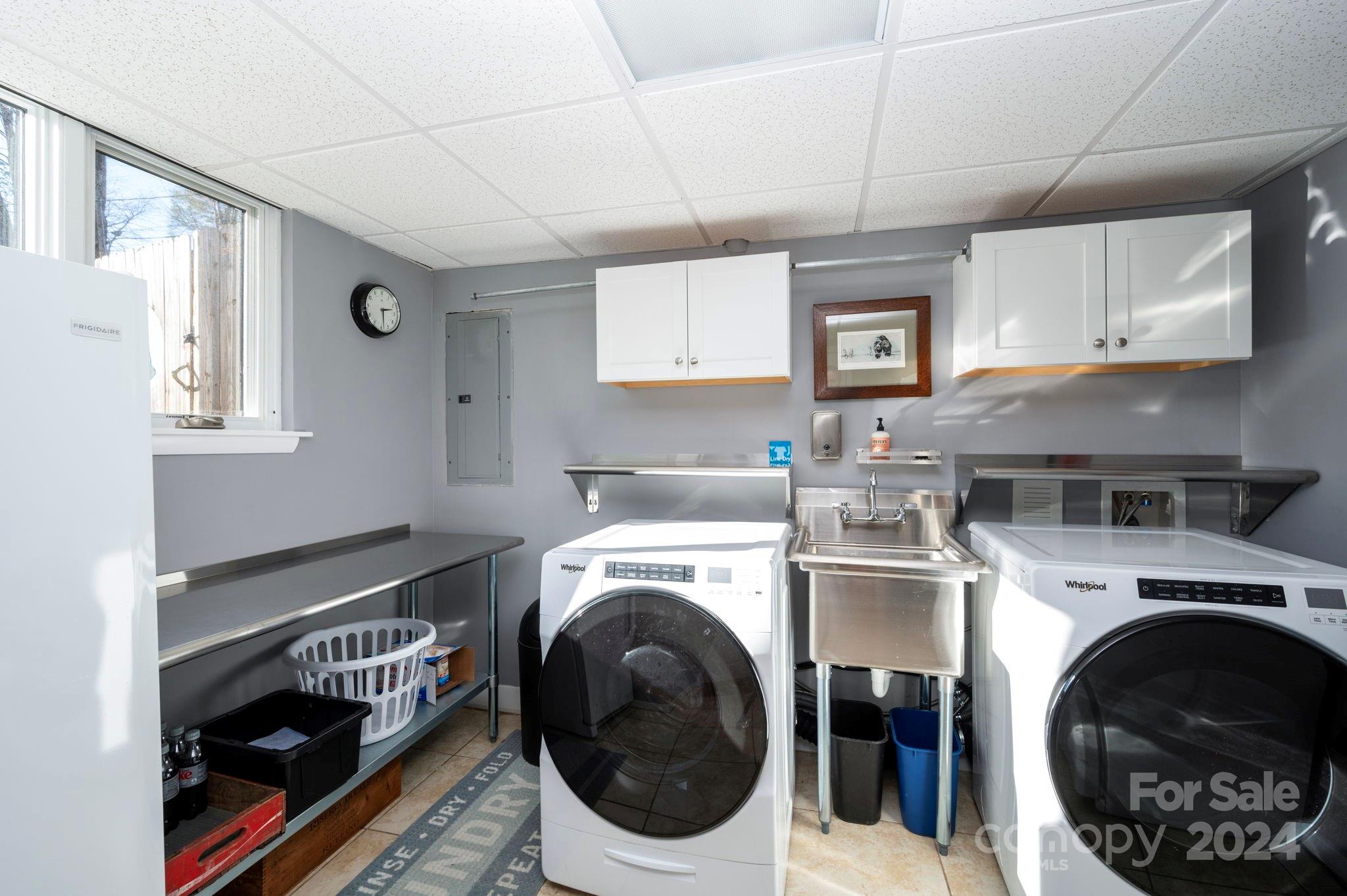 24 Maplewood Road Asheville, NC 28804 - Photo 29 of 38 a utility room with dryer washer and a view of kitchen
