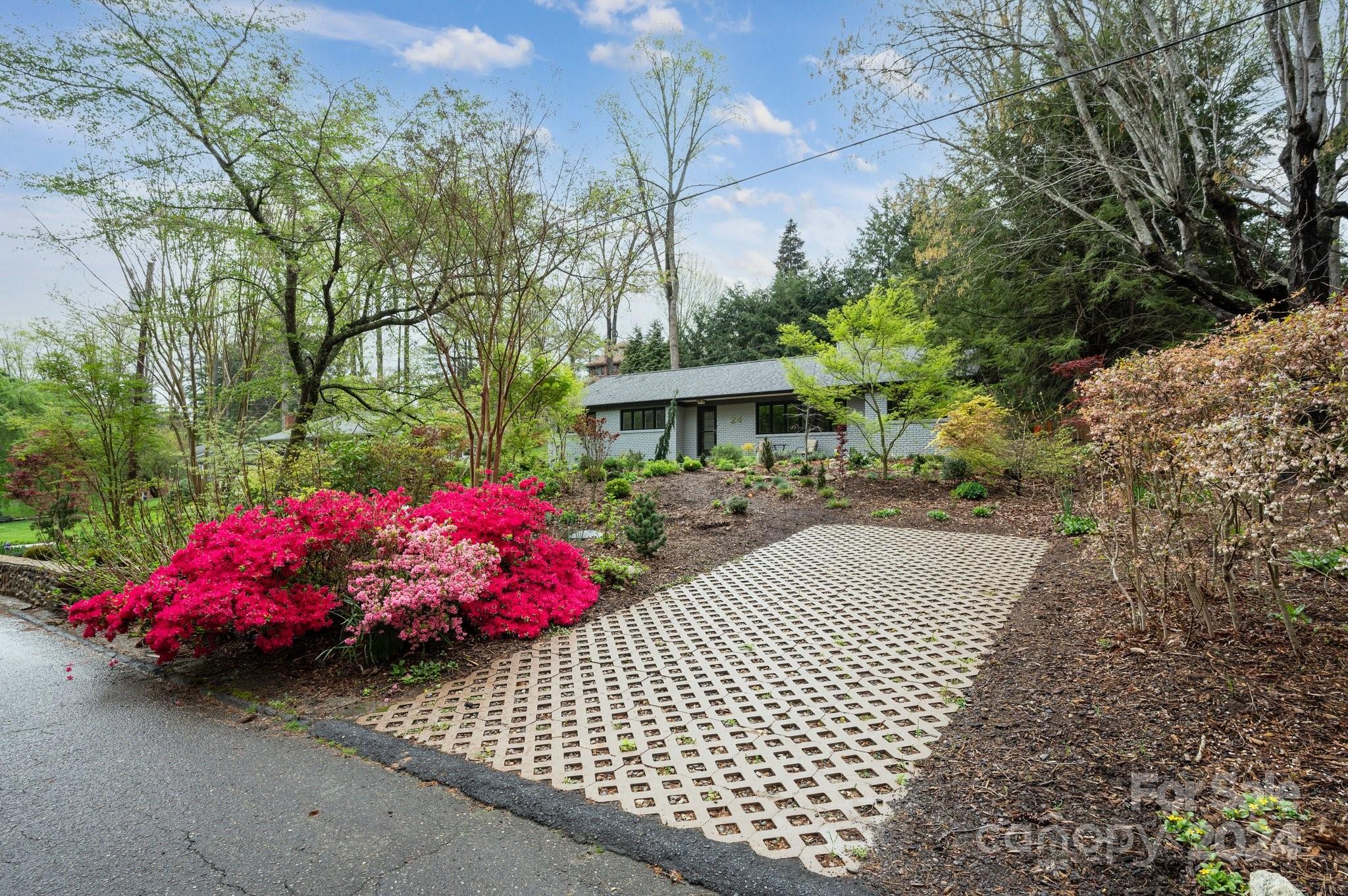 24 Maplewood Road Asheville, NC 28804 - Photo 31 of 38 a view of a patio with a table and chairs and potted plants