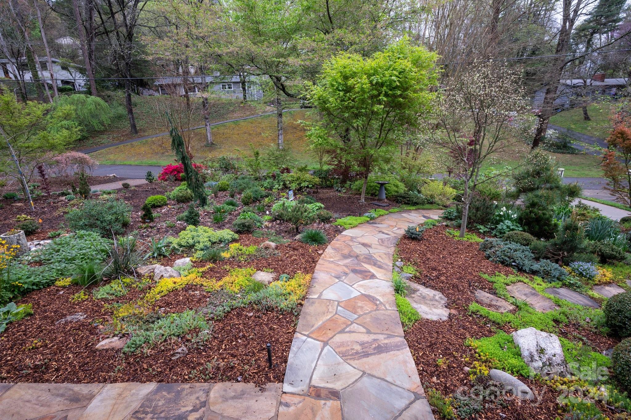 24 Maplewood Road Asheville, NC 28804 - Photo 4 of 38 a view of a pathway both side of yard