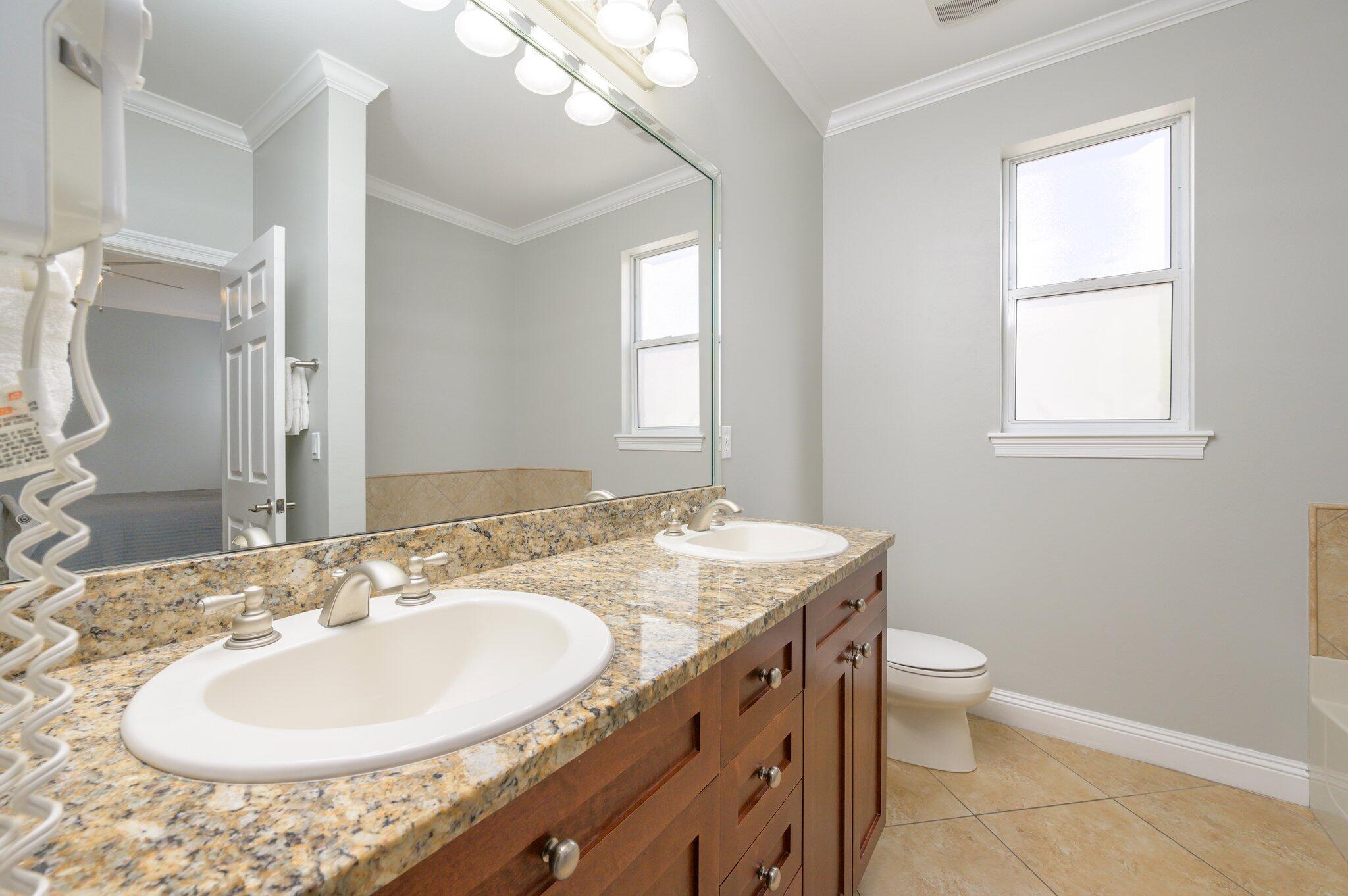 223 Grand Key Loop East Destin, FL 32541 - Photo 23 of 75 Main floor bedroom with en suite bath