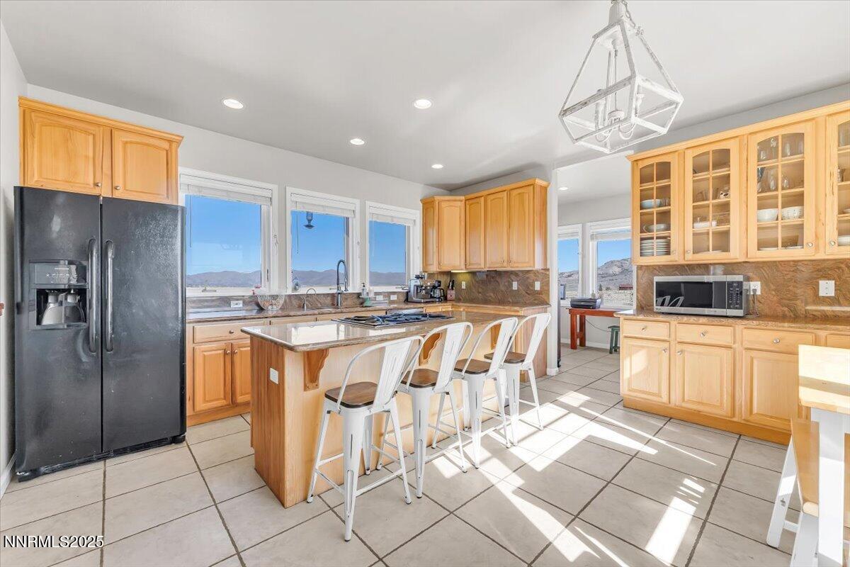 400 Britt Road Reno, NV 89508 - Photo 11 of 53 a kitchen with stainless steel appliances granite countertop a refrigerator and a stove top oven