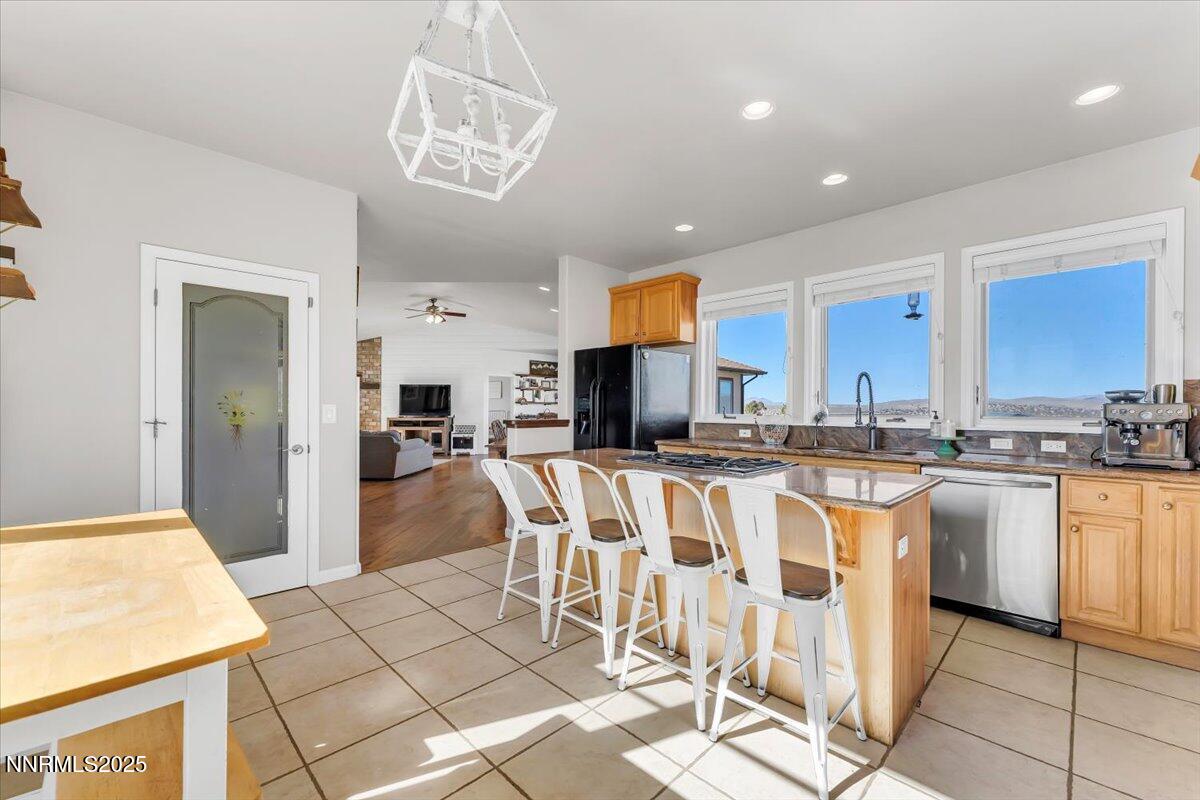 400 Britt Road Reno, NV 89508 - Photo 12 of 53 a kitchen with stainless steel appliances granite countertop a refrigerator and a stove top oven