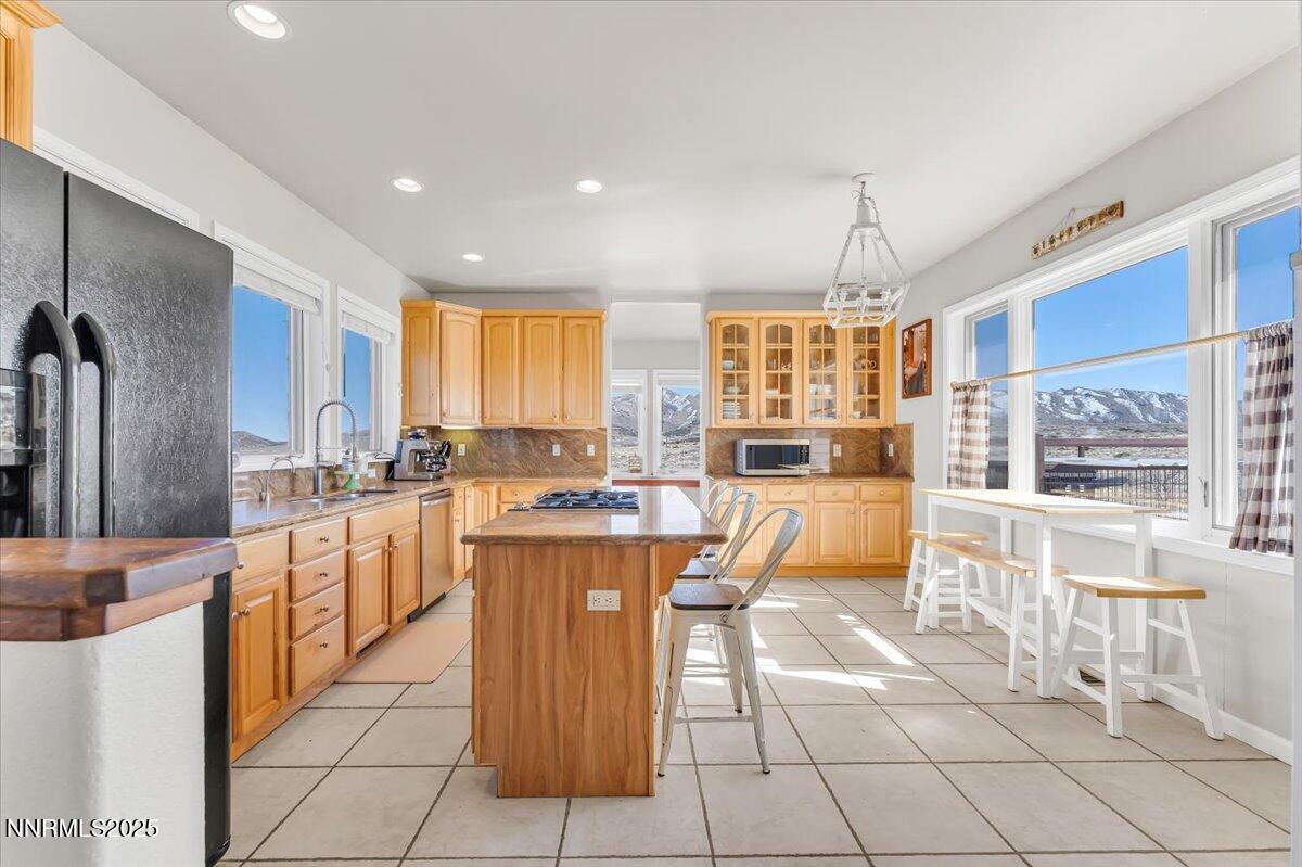 400 Britt Road Reno, NV 89508 - Photo 10 of 53 a large kitchen with granite countertop a large counter top space and stainless steel appliances