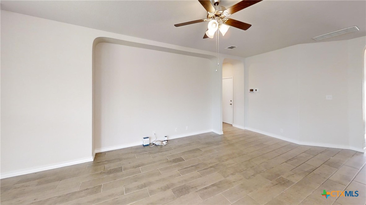 602 Steele Shallows Cibolo, TX 78108 - Photo 4 of 10 a view of an empty room with a fan