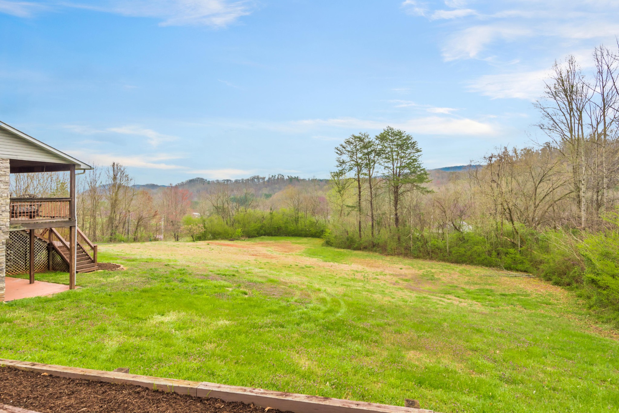 1521 Blockhouse Road Maryville, TN 37803 - Photo 4 of 40 a view of a swimming pool with an outdoor seating and a yard