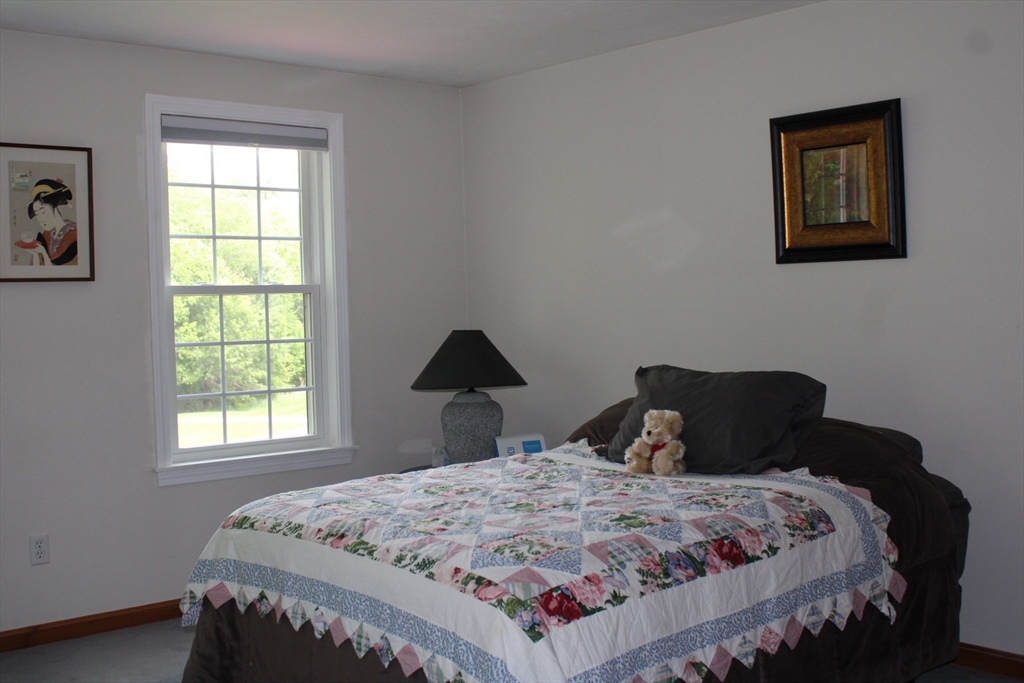 27 Gretchen Way Raynham, MA 02767 - Photo 11 of 20 a bedroom with a bed and a window