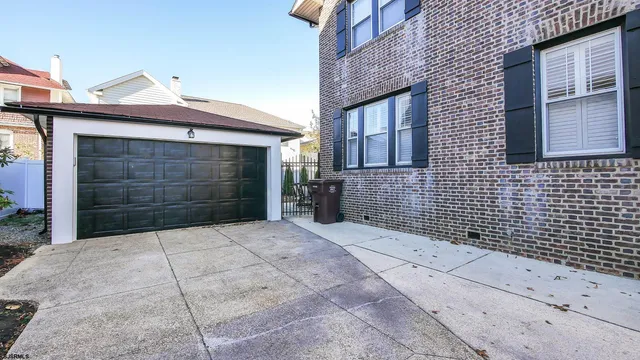 a front view of a house with parking