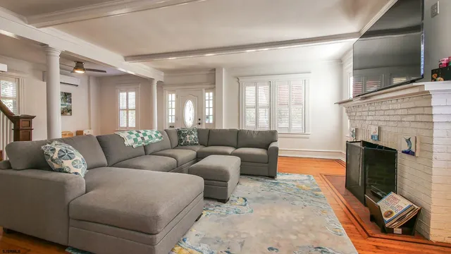 a living room with furniture and a fireplace