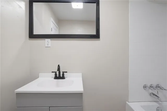 a sink with a mirror