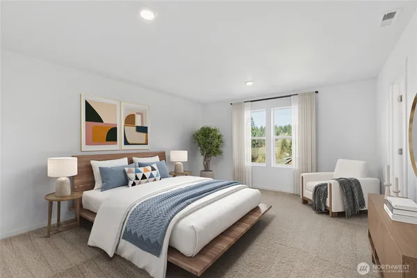 a spacious bedroom with a bed and wooden floor