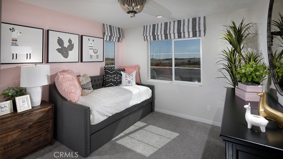 36970 Corvina Way Beaumont, CA 92223 - Photo 9 of 12 a living room with furniture and a potted plant