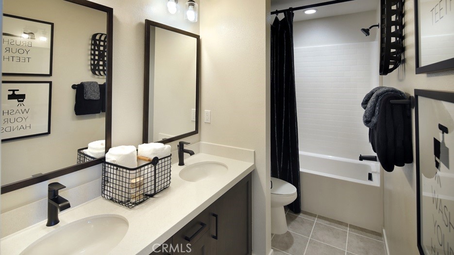 36970 Corvina Way Beaumont, CA 92223 - Photo 10 of 12 a bathroom with a granite countertop sink and a mirror