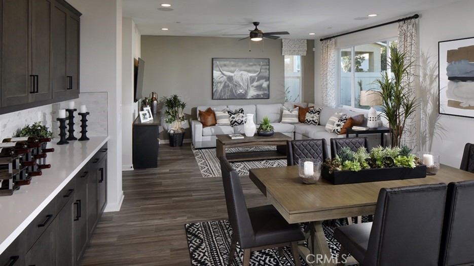 36970 Corvina Way Beaumont, CA 92223 - Photo 2 of 12 a dining room with furniture and wooden floor