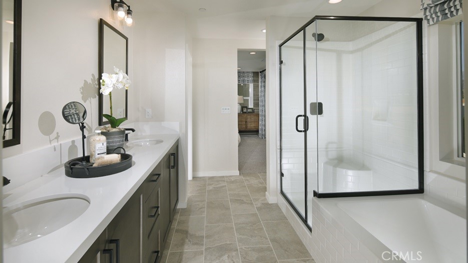 36970 Corvina Way Beaumont, CA 92223 - Photo 6 of 12 a bathroom with a sink and a mirror