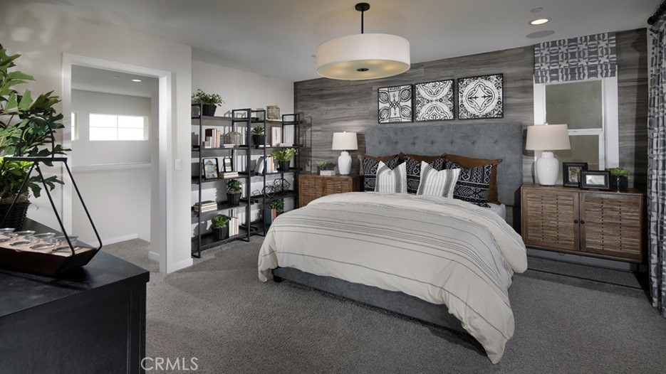 36970 Corvina Way Beaumont, CA 92223 - Photo 8 of 12 a bed room with a bed and a flat screen tv