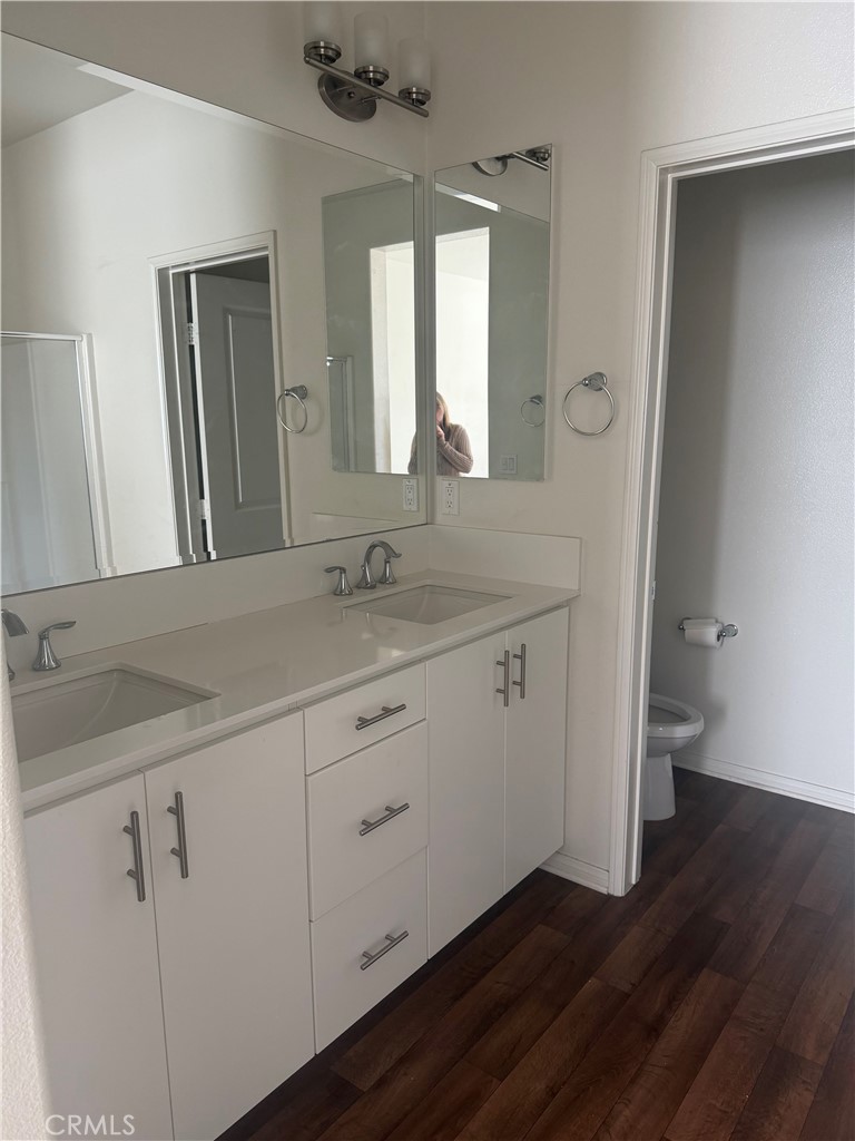 7357 Solstice Place Rancho Cucamonga, CA 91739 - Photo 11 of 12 a bathroom with a granite countertop sink and a mirror