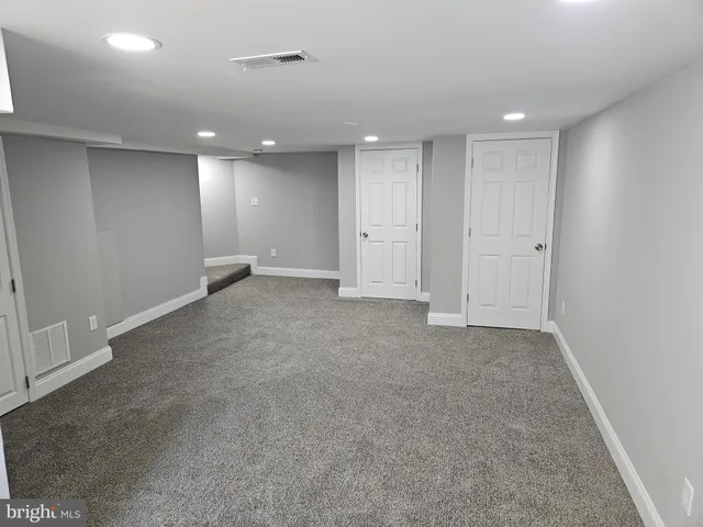 an empty room with a bathroom