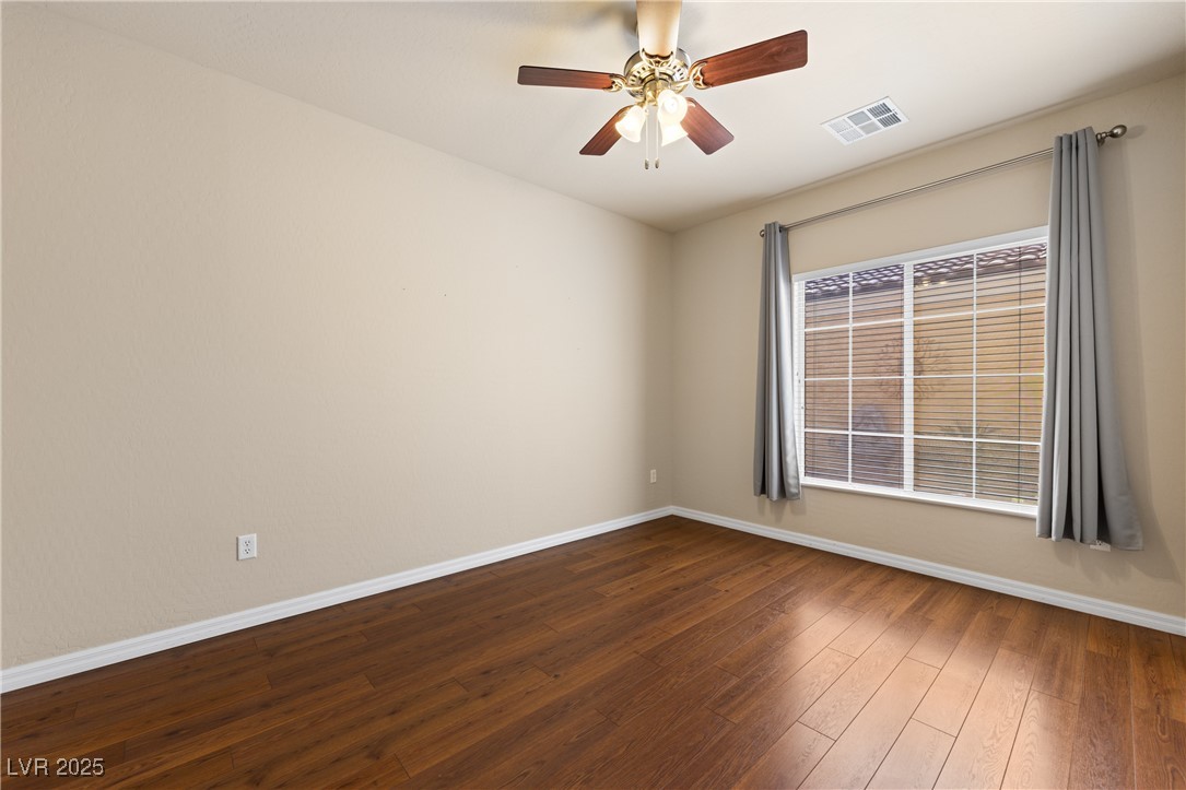 1551 Watchmans Point Mesquite, NV 89034 - Photo 12 of 62 Spare room featuring wood-type flooring and ceiling fan