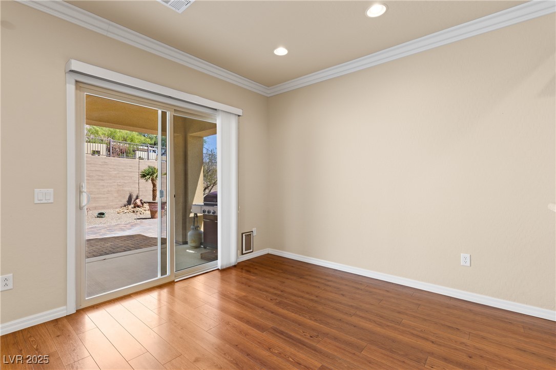 1551 Watchmans Point Mesquite, NV 89034 - Photo 22 of 62 Spare room with ornamental molding, wood finished floors, and recessed lighting