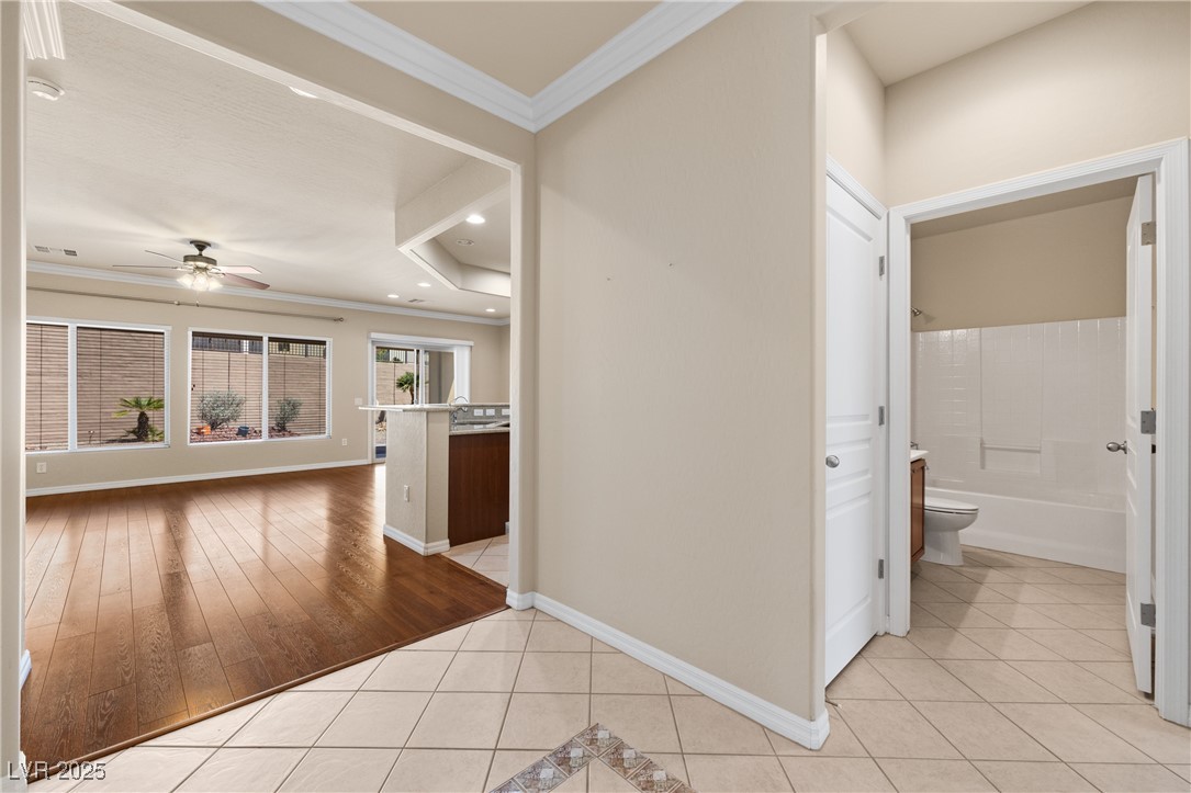 1551 Watchmans Point Mesquite, NV 89034 - Photo 9 of 62 Hall with ornamental molding, light tile patterned floors, and recessed lighting