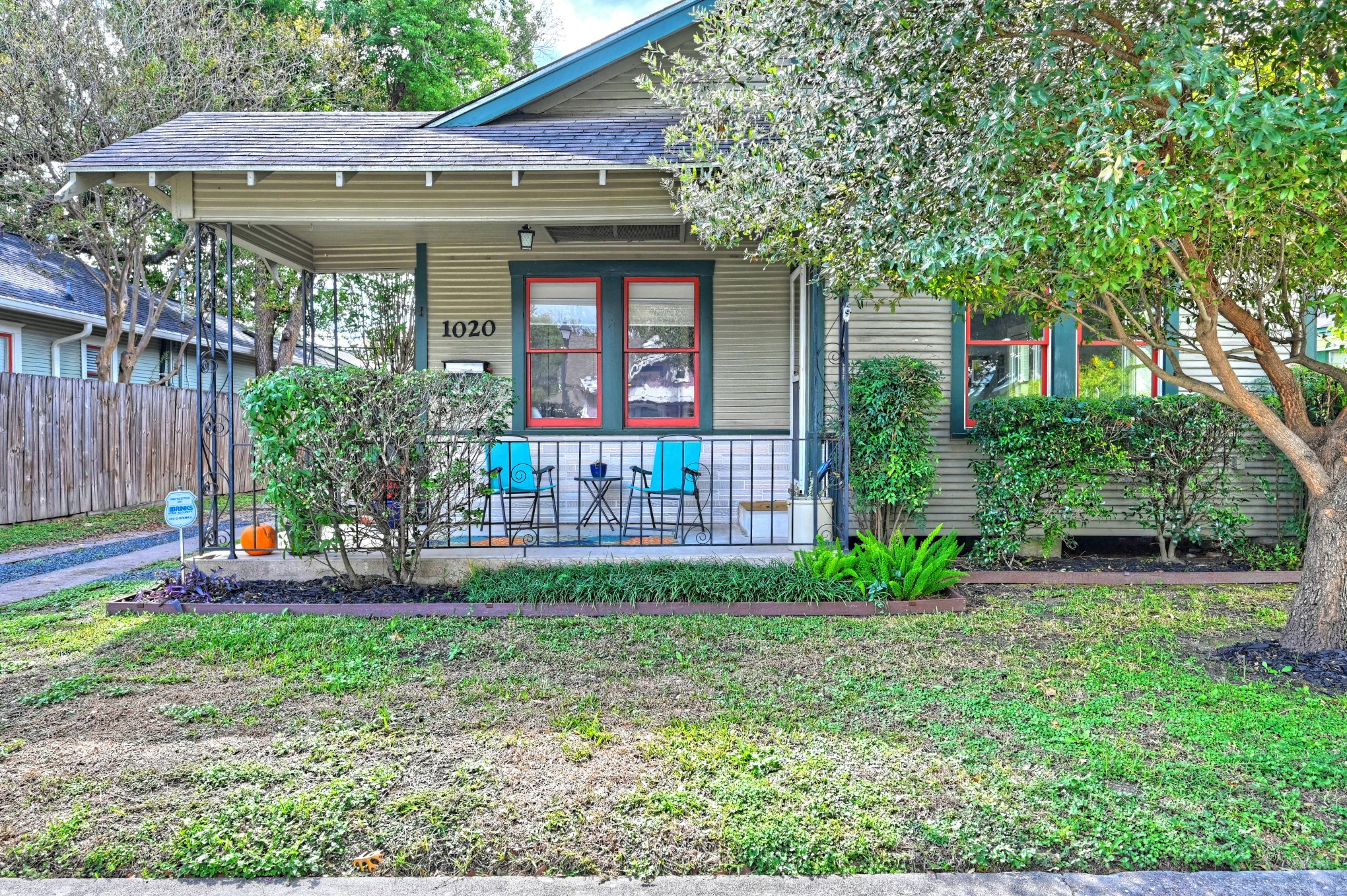 a front view of a house with garden