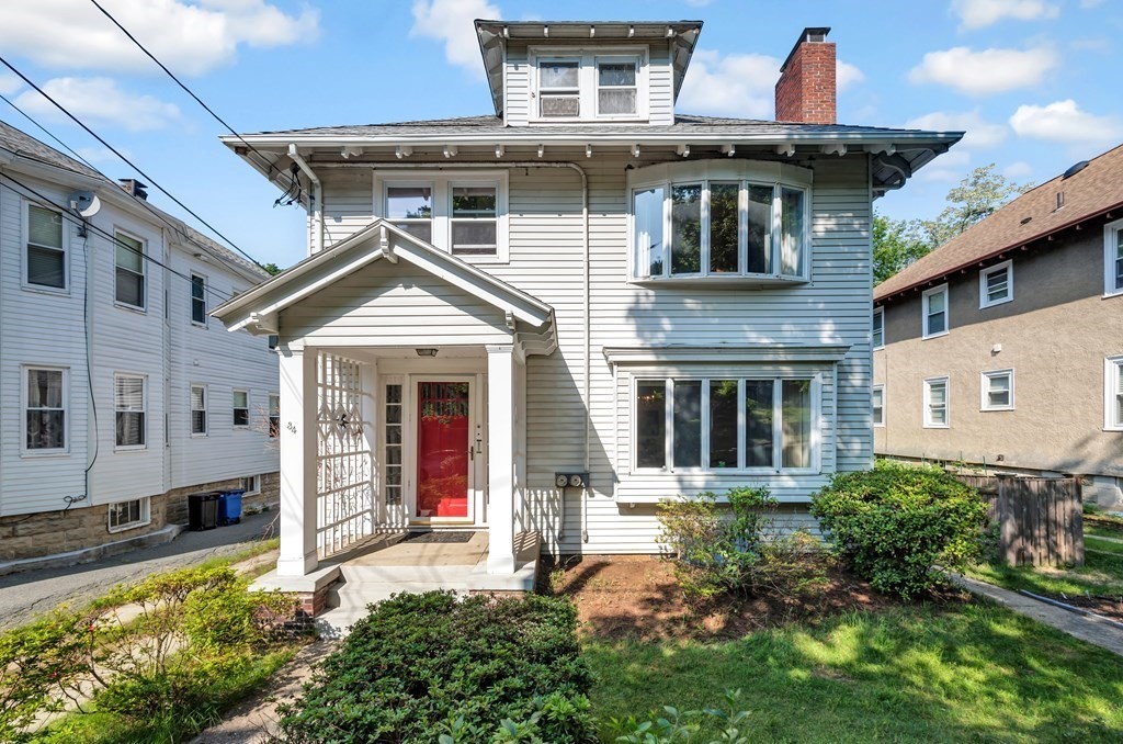 a front view of a house with a yard