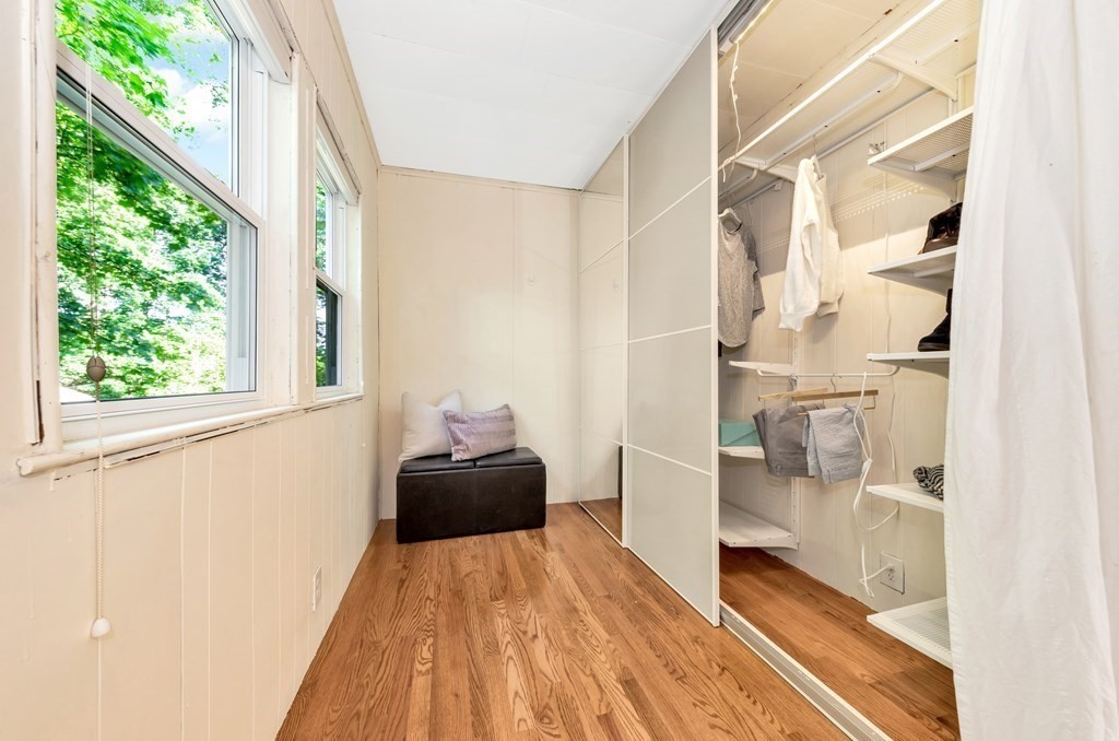 34 Harvard Street, Unit 1 Arlington, MA 02476 - Photo 33 of 36 a view of a bedroom with wooden floor and windows