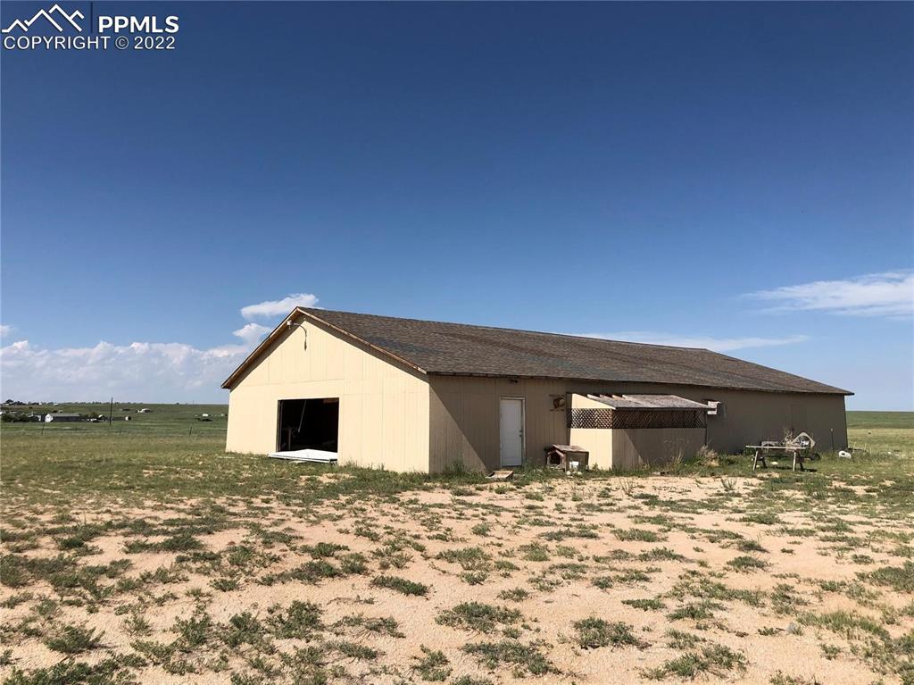 4455 Yoder Road Yoder, CO 80864 - Photo 12 of 12 a view of a house with a yard